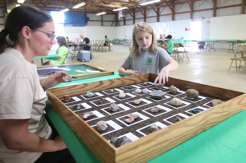 Reagan Sibigtroth of La Moille, has her rock collection judged by Ashley Wallace during the Bureau County 4-H Fair on Thursday, July 10, 2025 at the Bureau County Fairgrounds in Princeton.