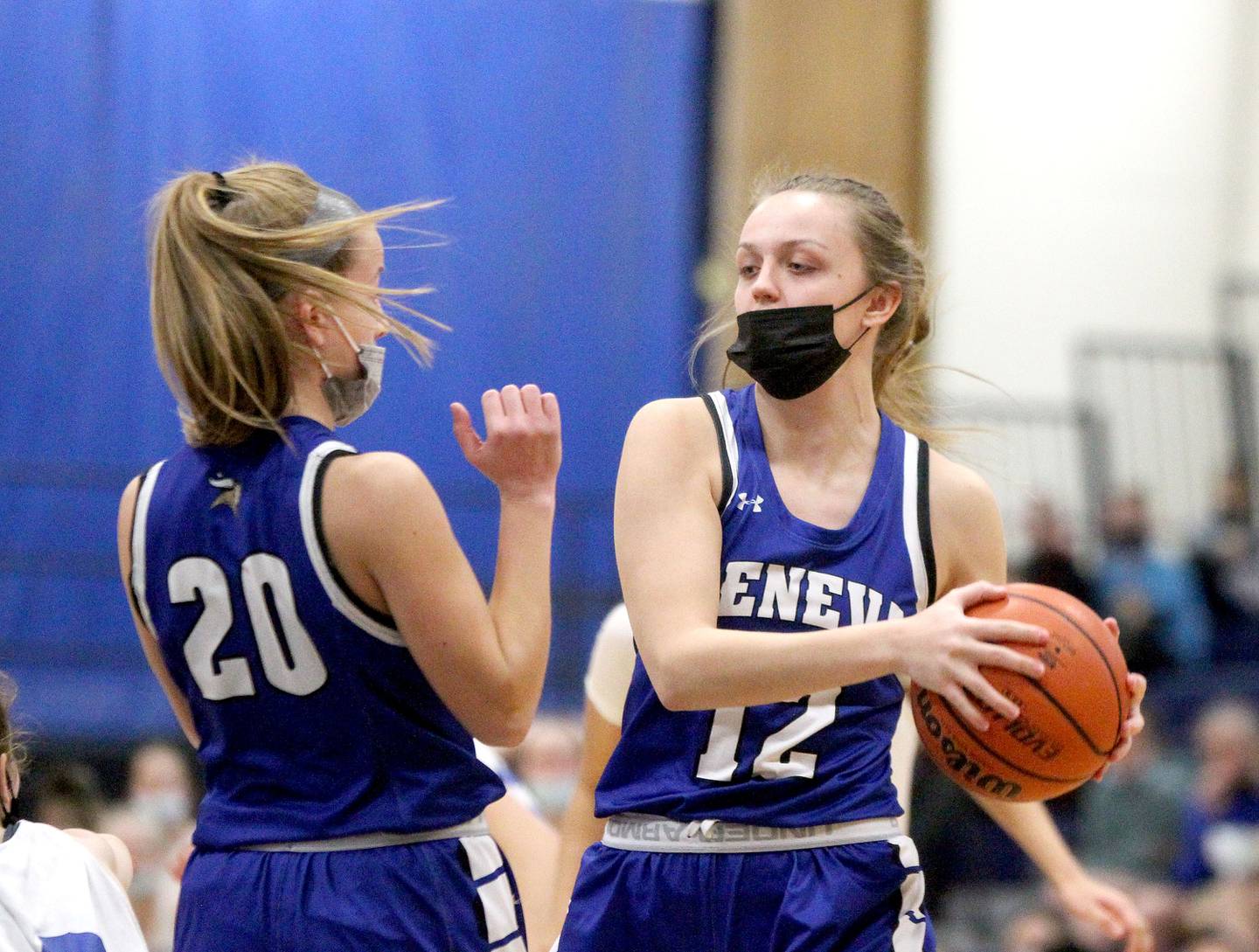 Geneva's Zosia Wrobel (12) looks to pass the ball during a game at Wheaton North on Saturday, Jan. 8, 2022.