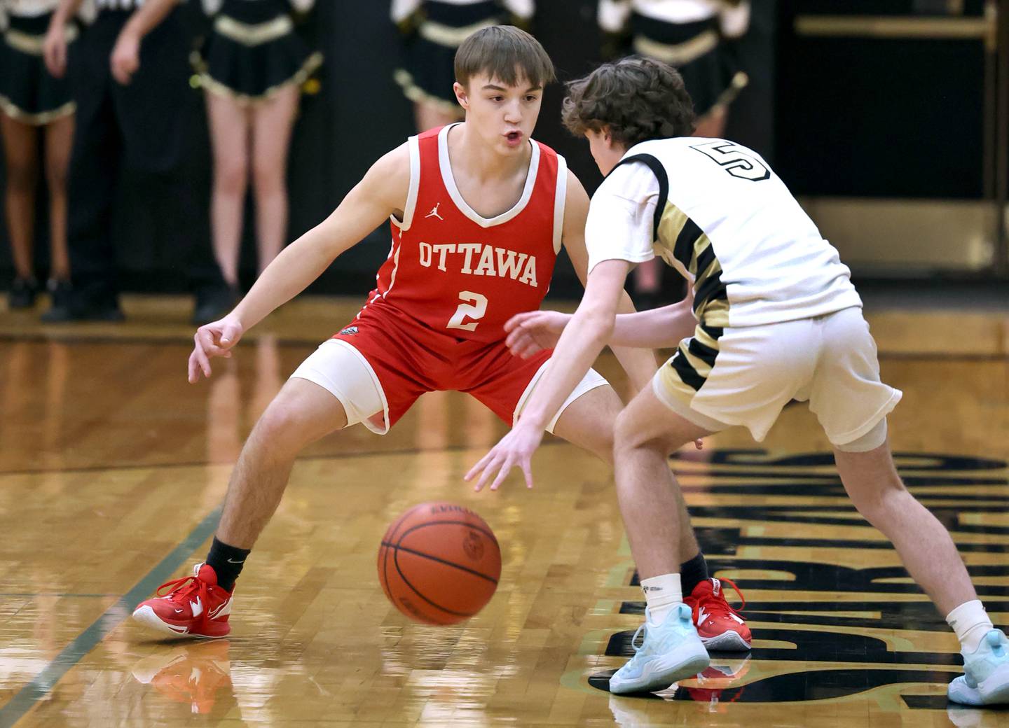 Ottawa's Huston Hart plays defense against Sycamore's Preston Picolotti during their game Friday, Dec. 16, 2022, at Sycamore High School.