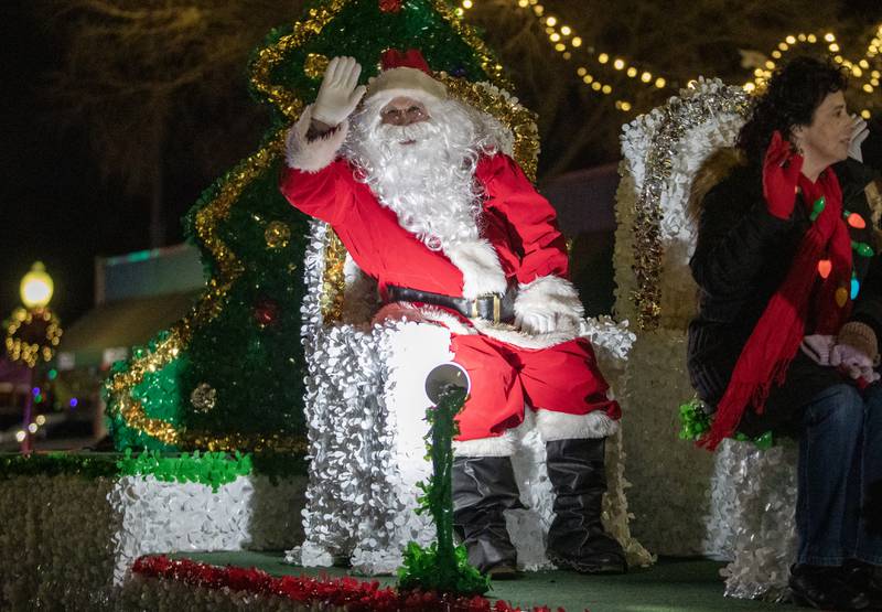 Santa Claus waves to paradegoers during the annual Holly Days Frosty & Friends Parade in Westmont on Saturday, December. 7, 2024.
