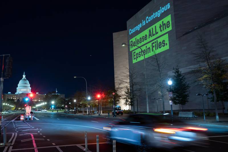 A World Without Exploitation projection is seen on the wall of the National Gallery of Art calling on Congress to vote yes on the Epstein files transparency act in Washington, Monday, Nov. 17, 2025. (AP Photo/Jose Luis Magana)