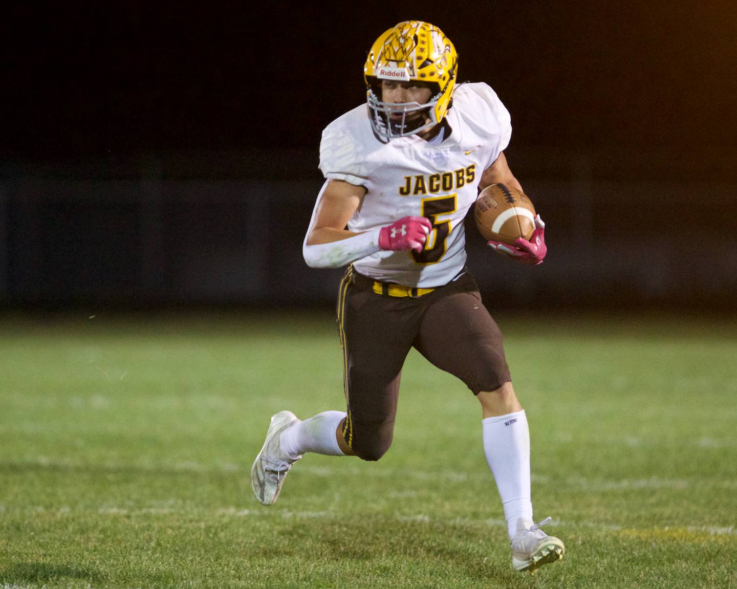 Jacobs' Matthew Scardina carries the ball for a gain against Burlington Central on Friday, October 4,2024 in Burlington.