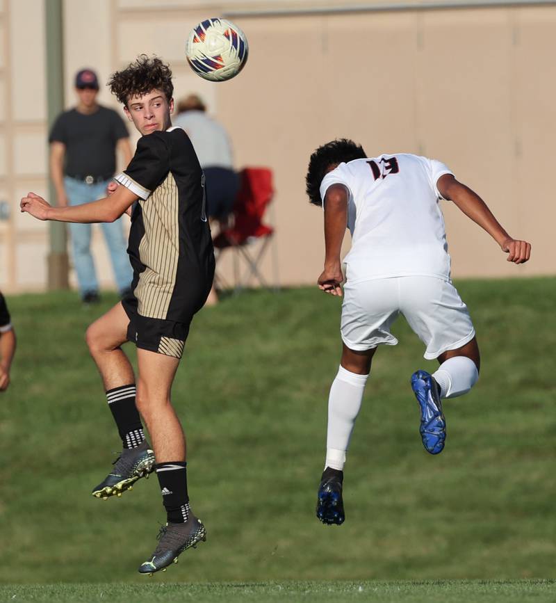 Sycamore's Noah Daykin (left) and DeKalb’s Henry Garcia Alvarez go for a header during their game Tuesday, Oct. 3, 2023, at Sycamore High School.