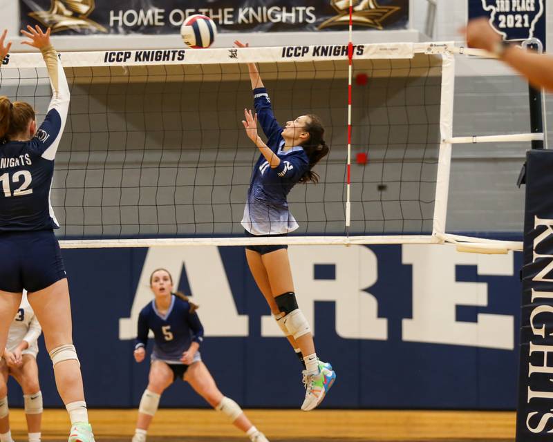 Nazareth's Tori Sarin (11) blasts a shot over the net during volleyball match between Nazareth at IC Catholic Prep.  Aug 29, 2023.