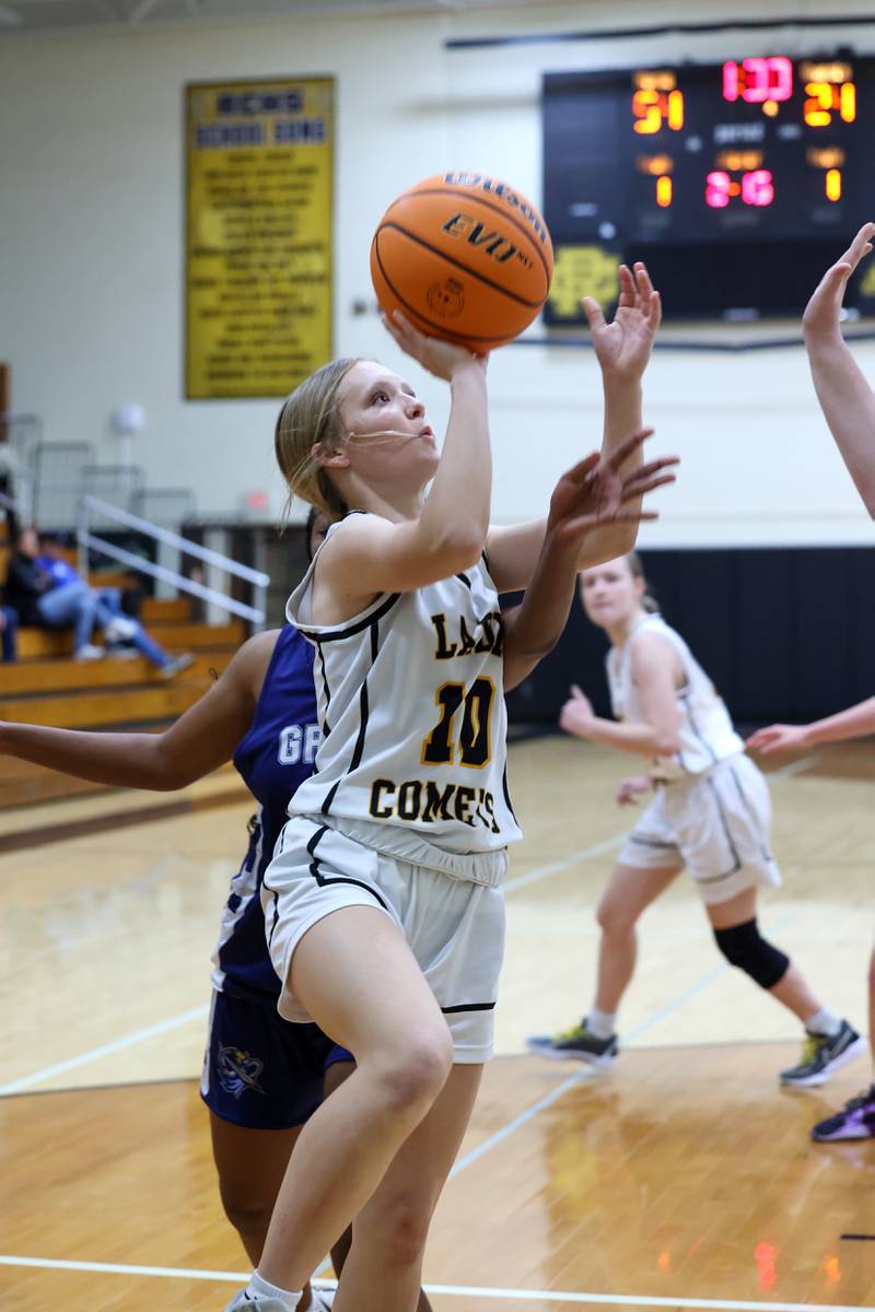 Reed-Custer's Kamryn Wilkey goes for a layup during the Comets' 55-24 victory over Grace Christian at the Reed-Custer Classic on Monday, Nov. 17, 2025.