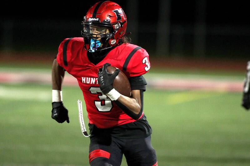 Huntley’s Omare Segarra runs the ball against Niles West  in first-round Class 8A playoff football action at Huntley Friday.