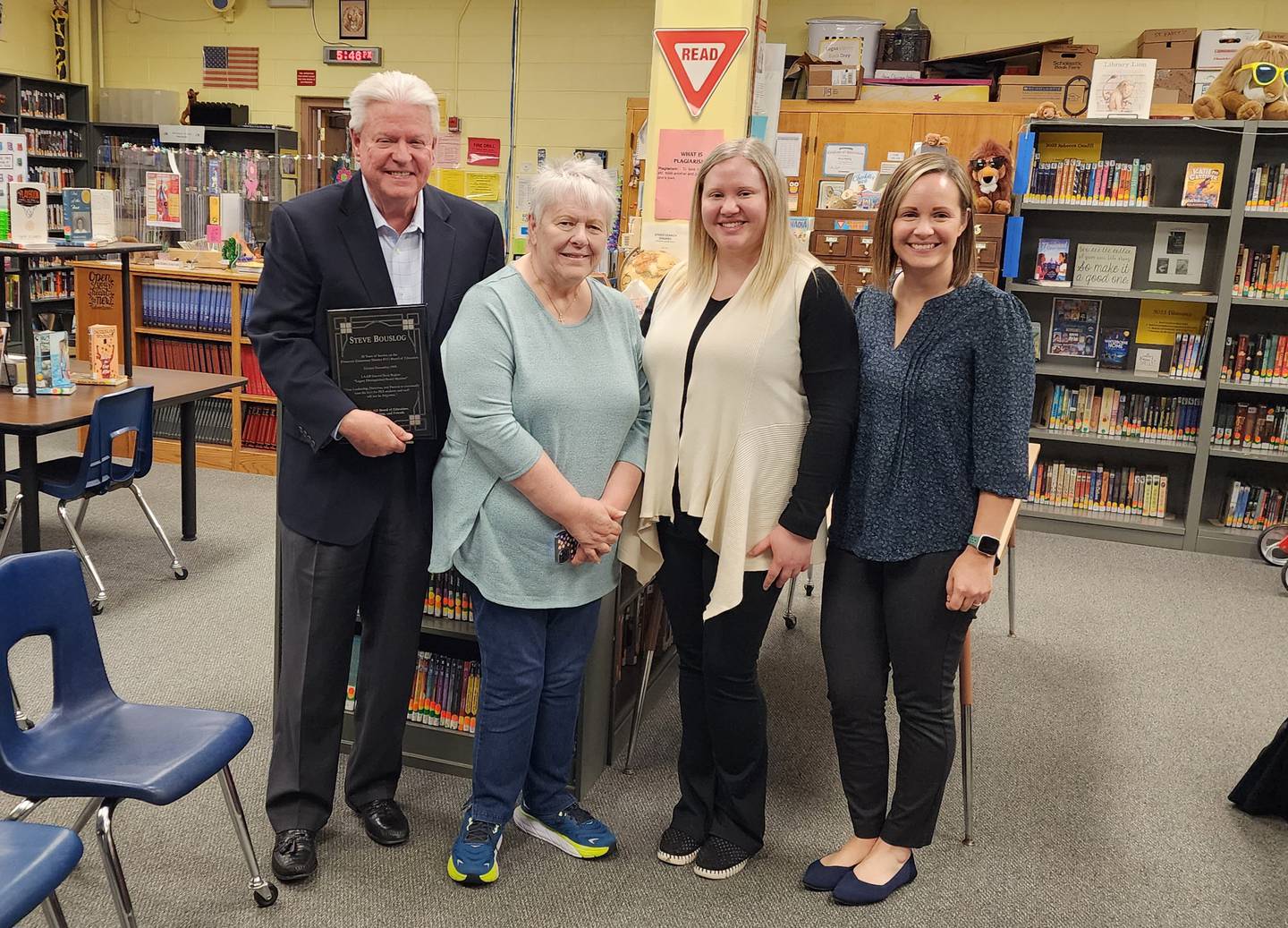 Current board members, Superintendent J.D. Orwig and members of his family gathered Monday to honor Bouslog’s years of service to the board.