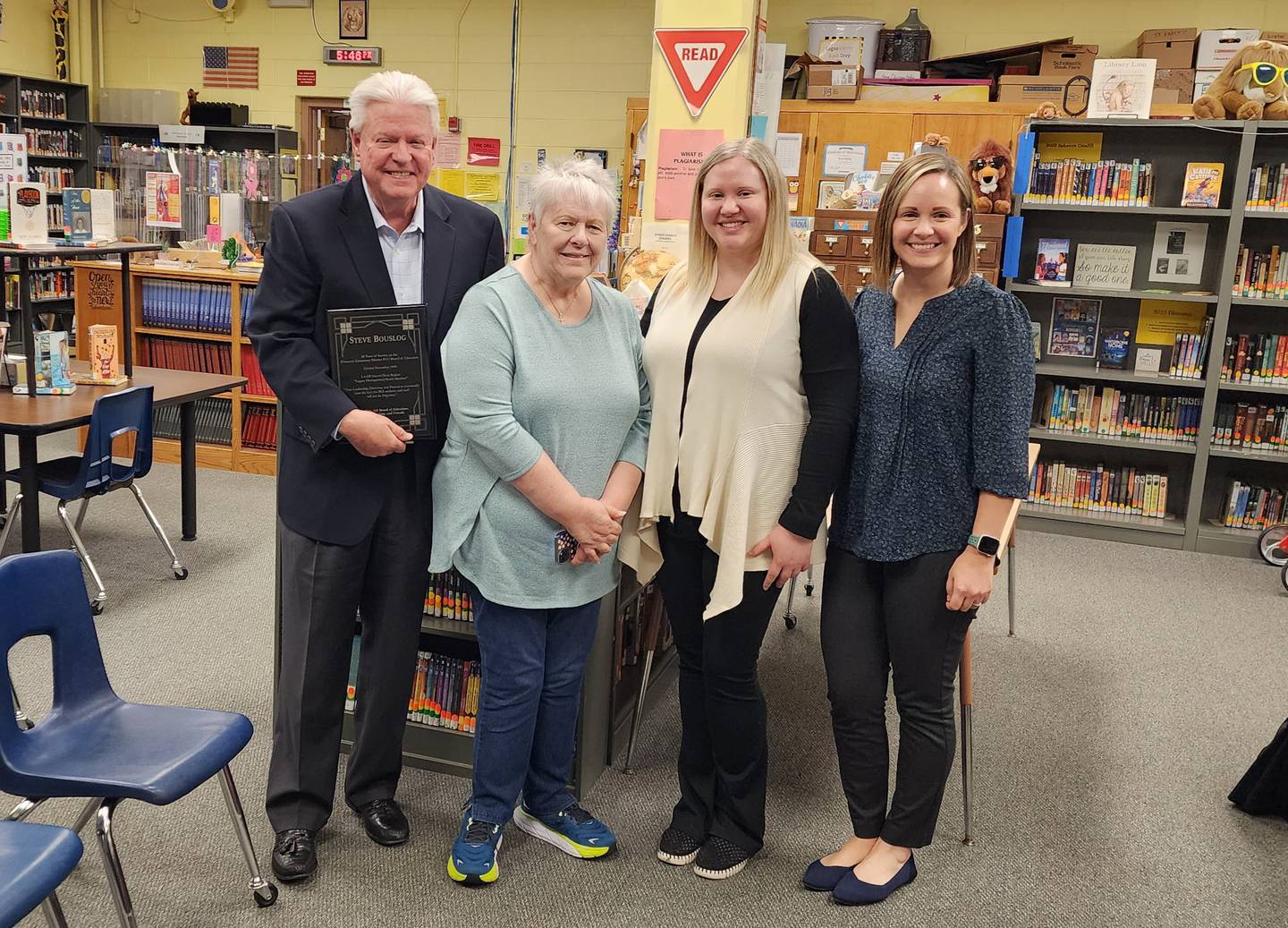 Current board members, Superintendent J.D. Orwig and members of his family gathered Monday to honor Bouslog’s years of service to the board.