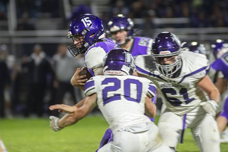Dixon’s Tyler Shaner picks ups yards against Rockford Lutheran Friday, Sept. 30, 2022.