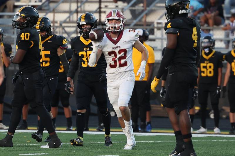 Morris’ Nazim Baftiri comes away with the turnover against Joliet West on Friday, Sept. 6, 2024 in Joliet.