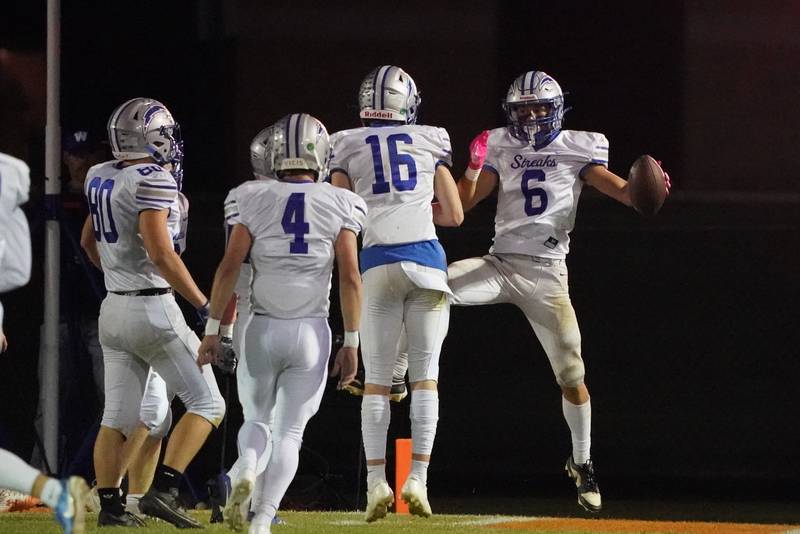 Woodstock's Matthew Cress (6) celebrates after scoring a touchdown against Sandwich during a football game at Sandwich High School on Friday, Oct. 11, 2024.