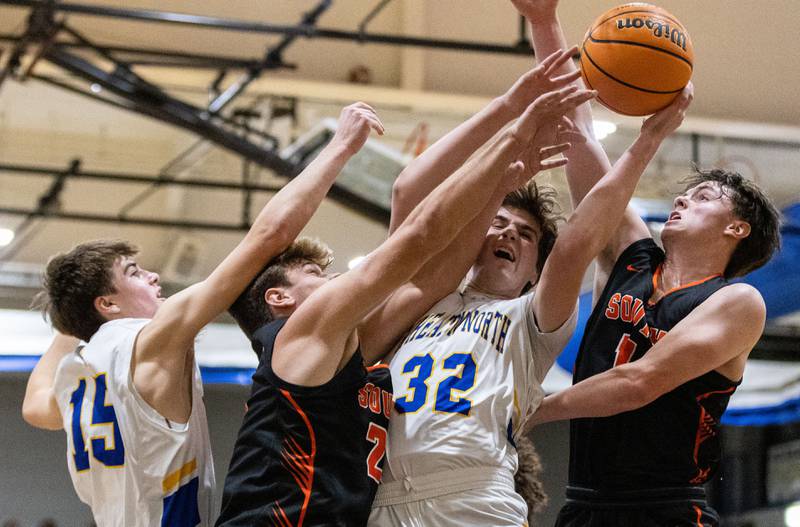 Wheaton North’s Ben Gillmar rebounds a ball during a home game against Wheaton Warrenville South on Friday, Dec. 20, 2024.