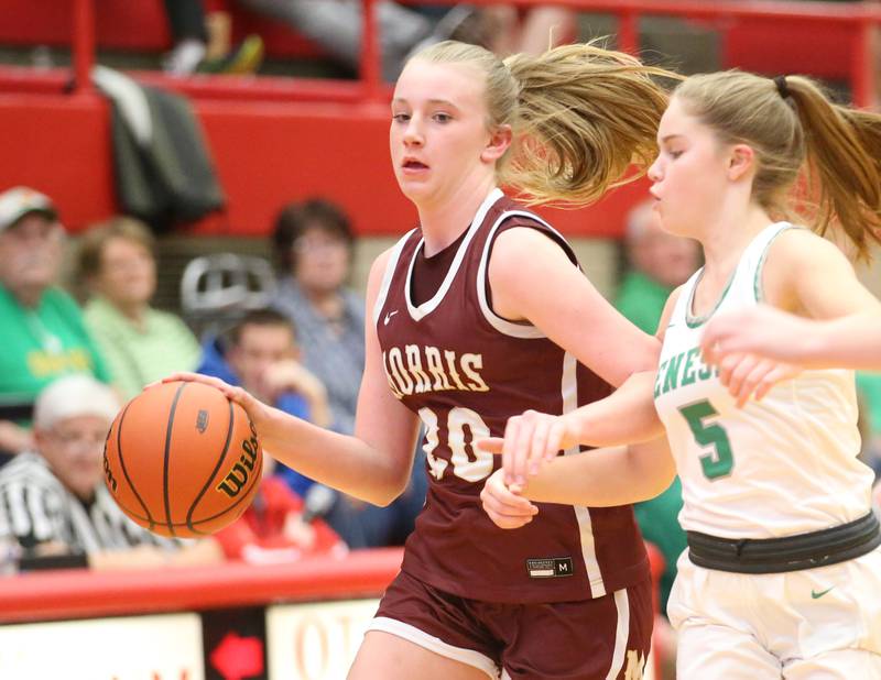 Morris's Landrie Callahan dribbles past Geneseo's Addison Snodgrass during the Class 3A Regional basketball game on Tuesday, Feb. 14, 2023 at Ottawa High School.