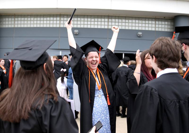 St. Charles East graduate Kip Kane celebrates following the school’s commencement ceremony at the Northern Illinois University Convocation Center in DeKalb on Monday, May 23, 2022.