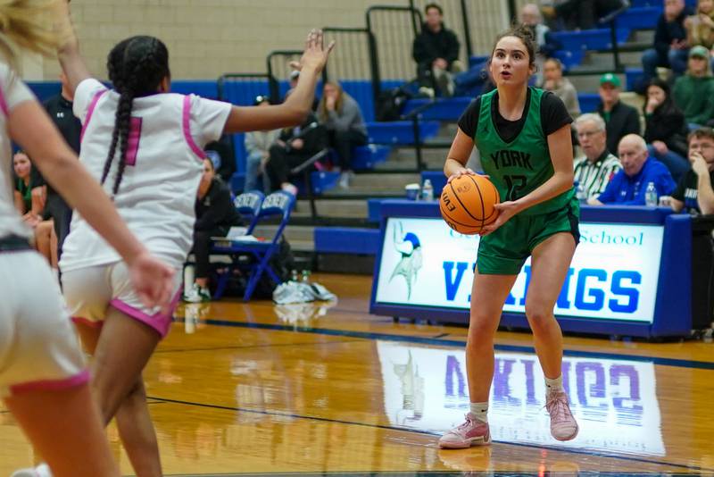 York's Ellie Kehoe (12) spots up for a 3-point attempt during a Class 4A Geneva Regional final basketball game against Batavia at Geneva High School on Thursday, Feb. 20, 2025.