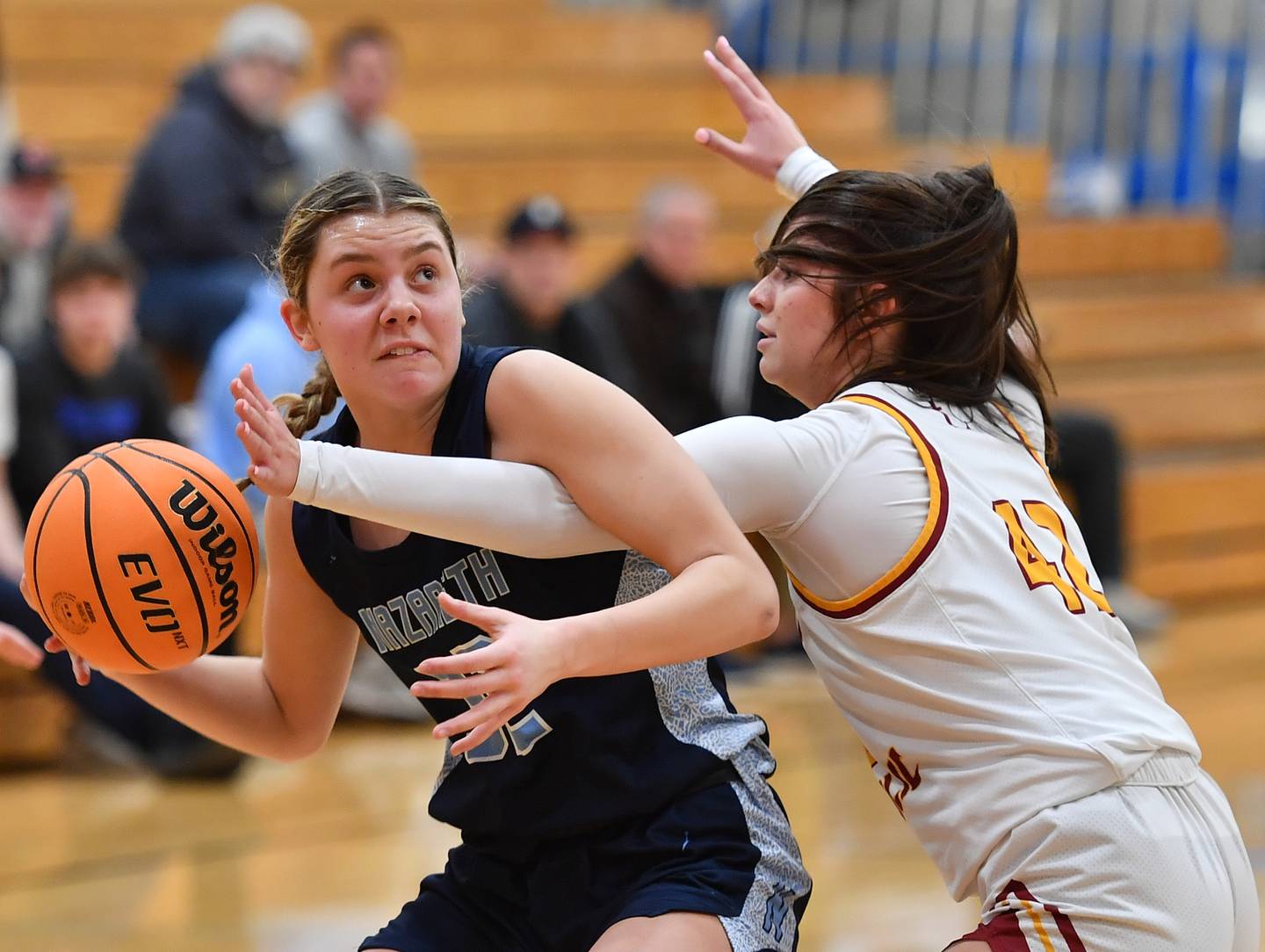 Nazareth’s Stella Sakalas is fouled by Montini’s Natalie Gartlan during a Coach Kipp Hoopsfest game on January 20, 2025 at Benet Academy in Lisle.