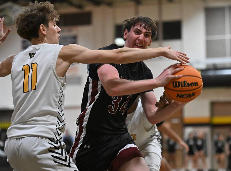 Plainfield North's Quintin Wiencek (34) pulls down a rebound during a conference game against Joliet West on Friday, Dec. 20, 2024, at Joliet.