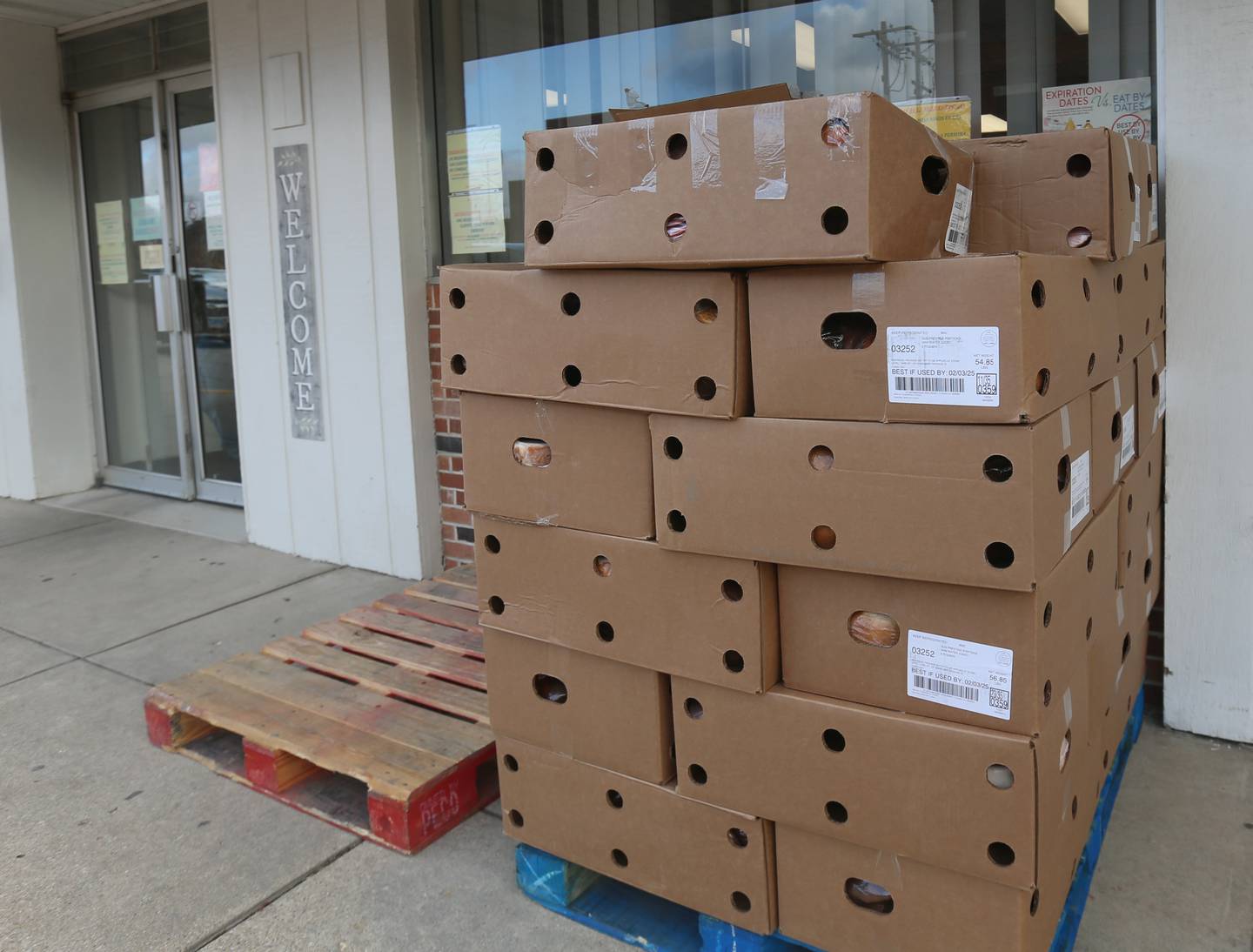 A full pallet of hams is placed outside during the Christmas distribution on Wednesday, Dec. 18, 2024 at the Illinois Valley Food Pantry in La Salle.