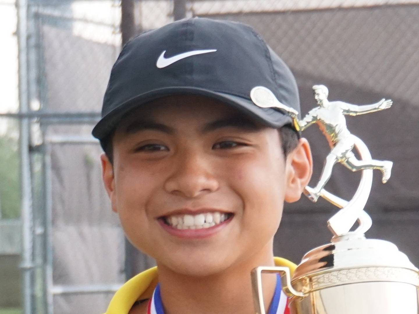 Jacobs freshman Samuel Santa Ines celebrates after the Golden Eagles won the Fox Valley Conference Tournament.