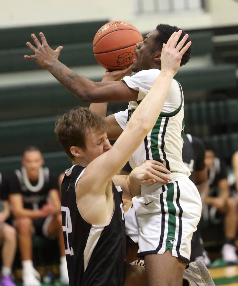 Kishwaukee College's Carron Gibson shoots over Rockford University's Kelso Tennant Thursday, Jan. 22, 2026, during their game at Kishwaukee College in Malta.