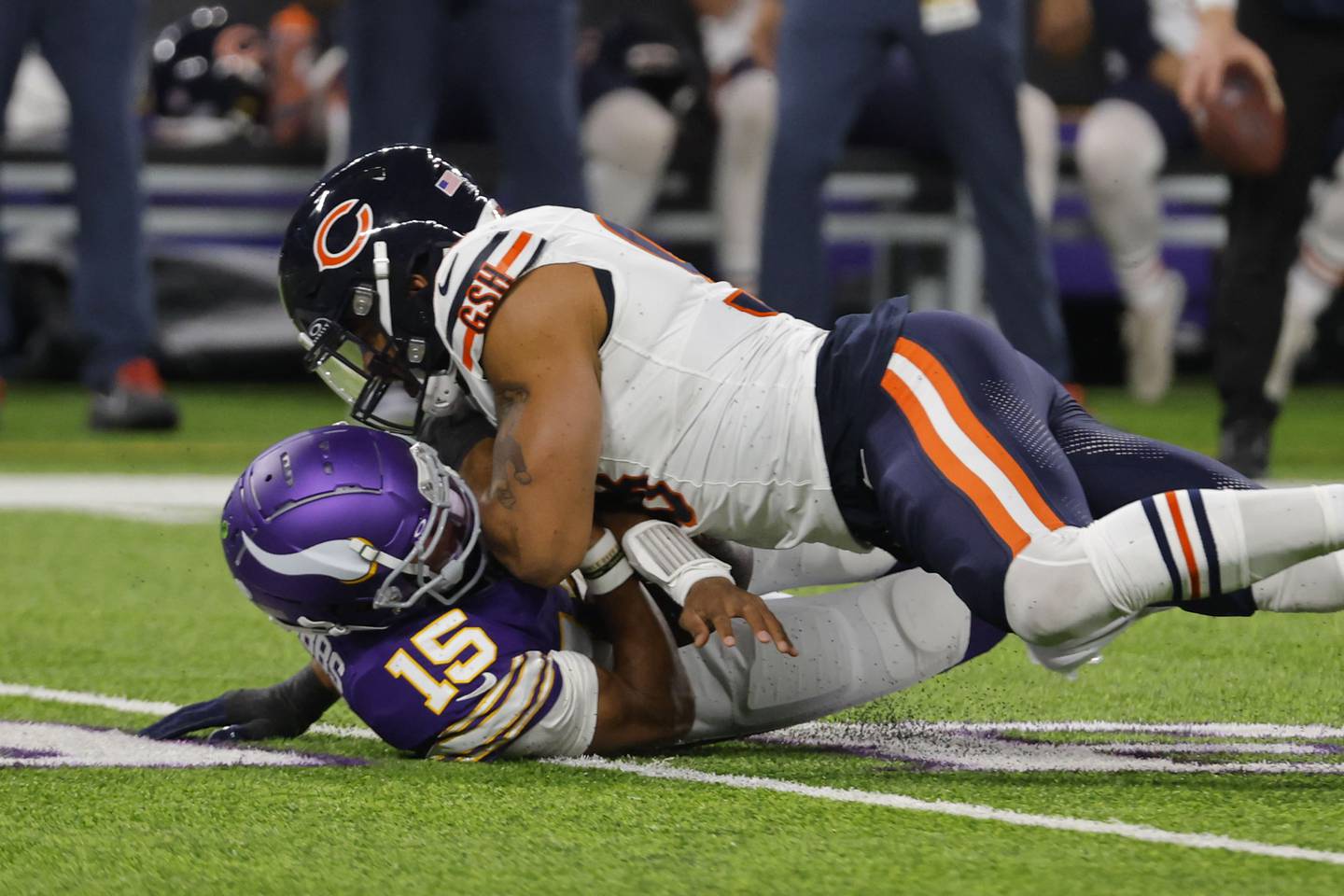 Minnesota Vikings quarterback Joshua Dobbs is sacked by Chicago Bears defensive end Montez Sweat during the first half, Monday, Nov. 27, 2023, in Minneapolis.