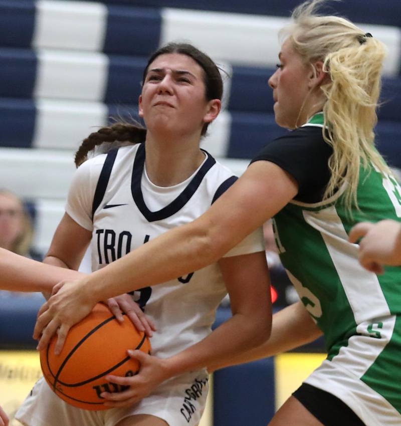Cary-Grove's Kennedy Manning is tied up by Crystal Lake South's Laken LePage during a Fox Valley Conference girls basketball game on Tuesday, Dec. 2, 2025, at Cary-Grove High School in Cary.