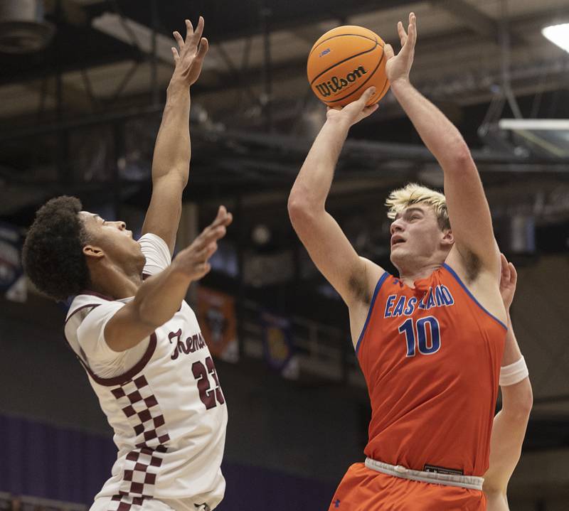 Eastland’s Zacyn Haverland puts up a shot over Tremont’s Brandon Tennon Monday, March 9, 2026, in the Class 1A Macomb Supersectional.