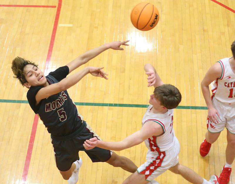 Morris's Luis Loza looks to pass the ball over L-P's Braylin Bond on Monday, Feb. 9, 2026 in Sellett Gymnasium at L-P High School.