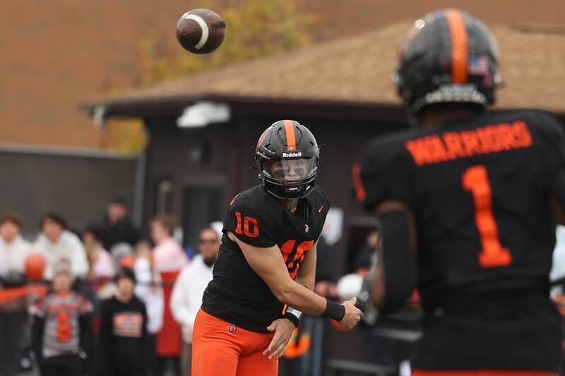 Lincoln-Way West’s Chase Hetfleisch passes to DeAndre Coates against Batavia on Saturday, Nov. 9, 2024 in New Lenox.