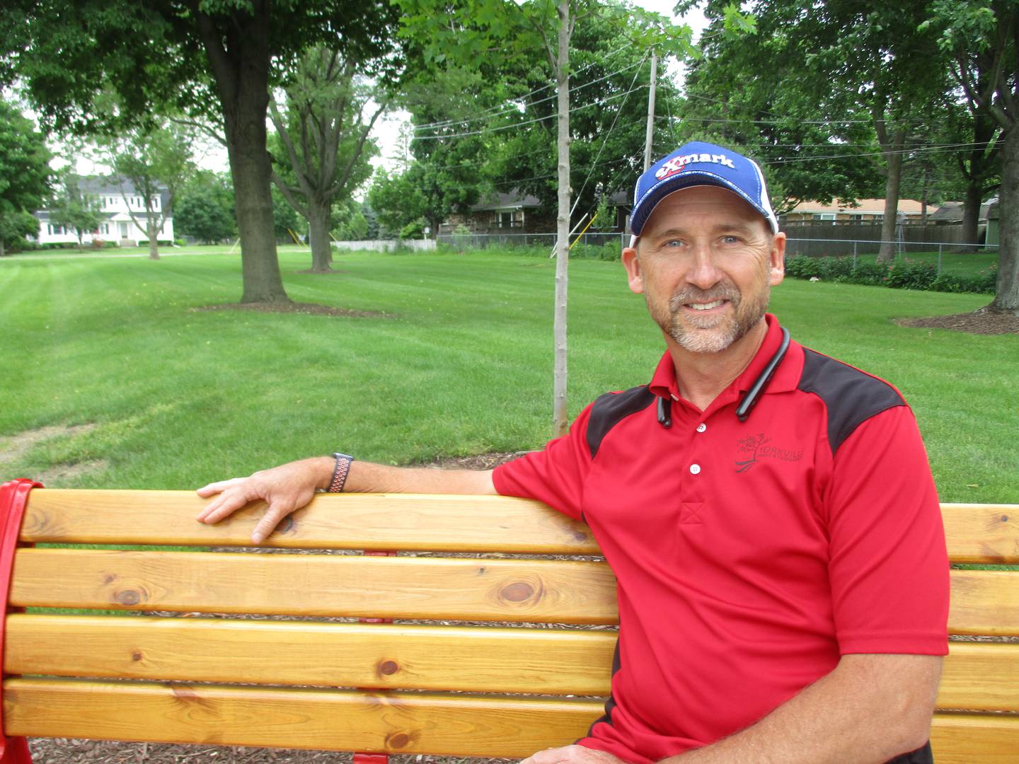 Yorkville Superintendent of Parks Scott Sleezer relaxes on a park bench in the immaculately groomed Beecher Park. (Mark Foster -- mfoster@shawmedia.com)