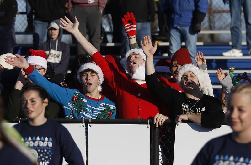 Cary-Grove fans wave goodbye to Lake Zurich after the Trojans defeated Lake Zurich in a IHSA Class 6A semifinal playoff football game on Saturday, Nov. 18, 2023, at Lake Zurich High School.