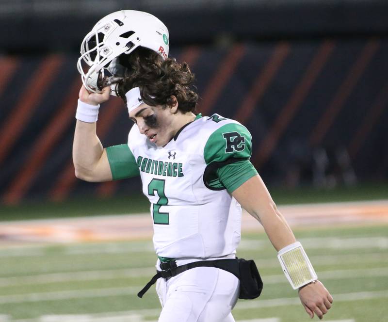 Providence Catholic quarterback Lucas Proudfoot takes his helmet off for the final time after loosing to Sacred Heart-Griffin in the Class 4A state title on Friday, Nov. 25, 2022 at Memorial Stadium in Champaign.