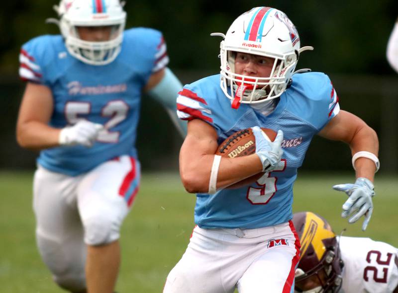 Marian Central’s Mike Schmid runs the ball against Richmond-Burton in varsity football at George Harding Field on the campus of Marian Central High School in Woodstock on Friday, August 29, 2025.