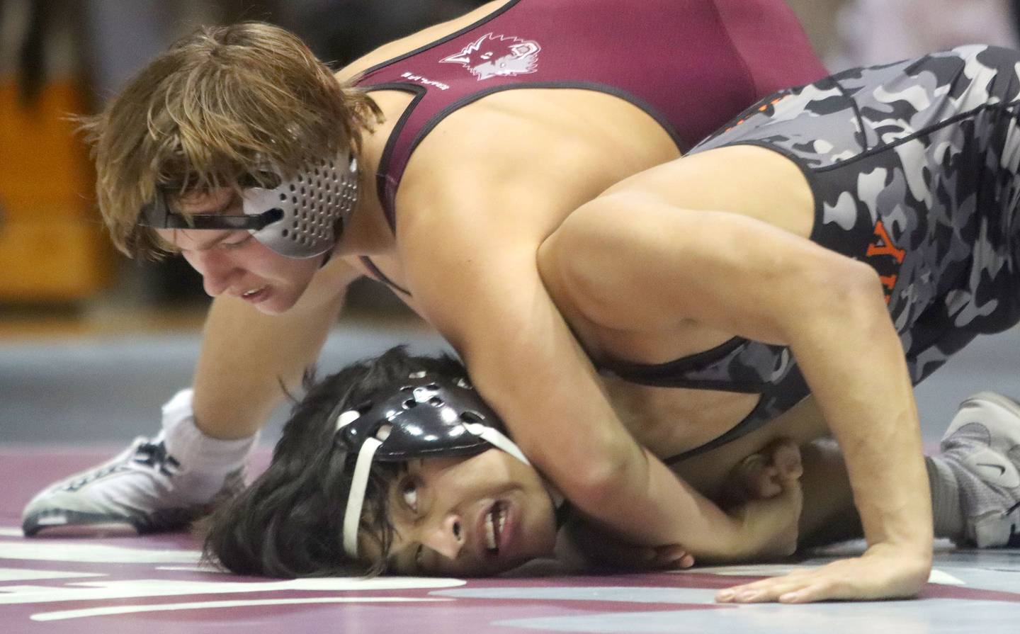 McHenry’s Elian Enciso, bottom, battles Prairie Ridge’s Jacob Meade at 165 pounds in varsity boys wrestling on Thursday, Jan. 8, 2026 at Prairie Ridge High School in Crystal Lake.