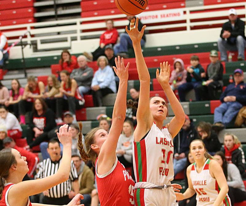 L-P's Bailey Pode shoots a jump shot over Ottawa's Hailey Larsen under the hoop on Friday, Jan. 27, 2023 at L-P High School.