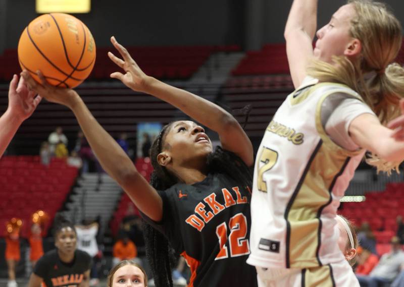 DeKalb's Brytasia Long tries to get a shot over Sycamore's Sadie Lang during their game Friday, Jan. 31, 2025, in the FNBO Challenge in the Convocation Center at Northern Illinois University in DeKalb.