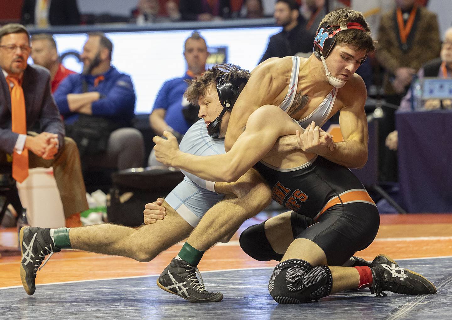 Marian Central’s Vance Williams (top) works on Illini Bluff’s Jackson Carroll in the 150 pound weight class of the 1A state individual wrestling finals Saturday, Feb. 22, 2025, at State Farm Center in Champaign.