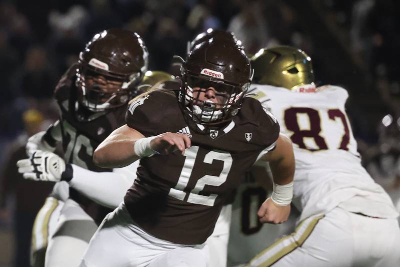 Joliet Catholic defensive end Zach Pomatto looks in to the St. Ignatius ball carrier on Friday, Oct. 20 in Joliet.