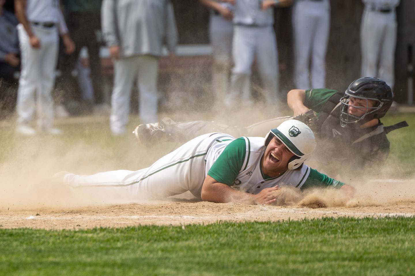 (22) Alan Spencer of St. Bede screams after being tagged at home plate by (30) Z. Schwanke of Midland on Saturday, May 24, 2025 at Stark County High School in Toulon.