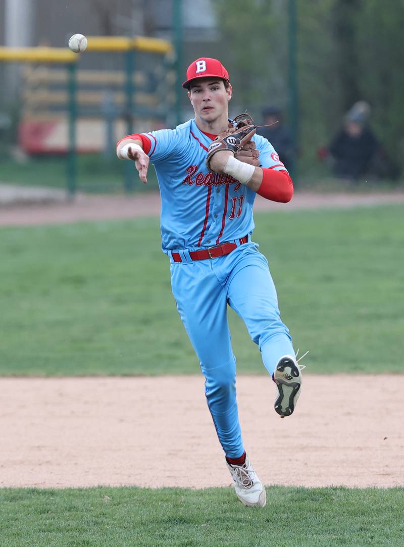 Benet's Luke Bafia (11) throws to first during the varsity baseball game between Benet Academy and Nazareth Academy in La Grange Park on Monday, April 24, 2023.