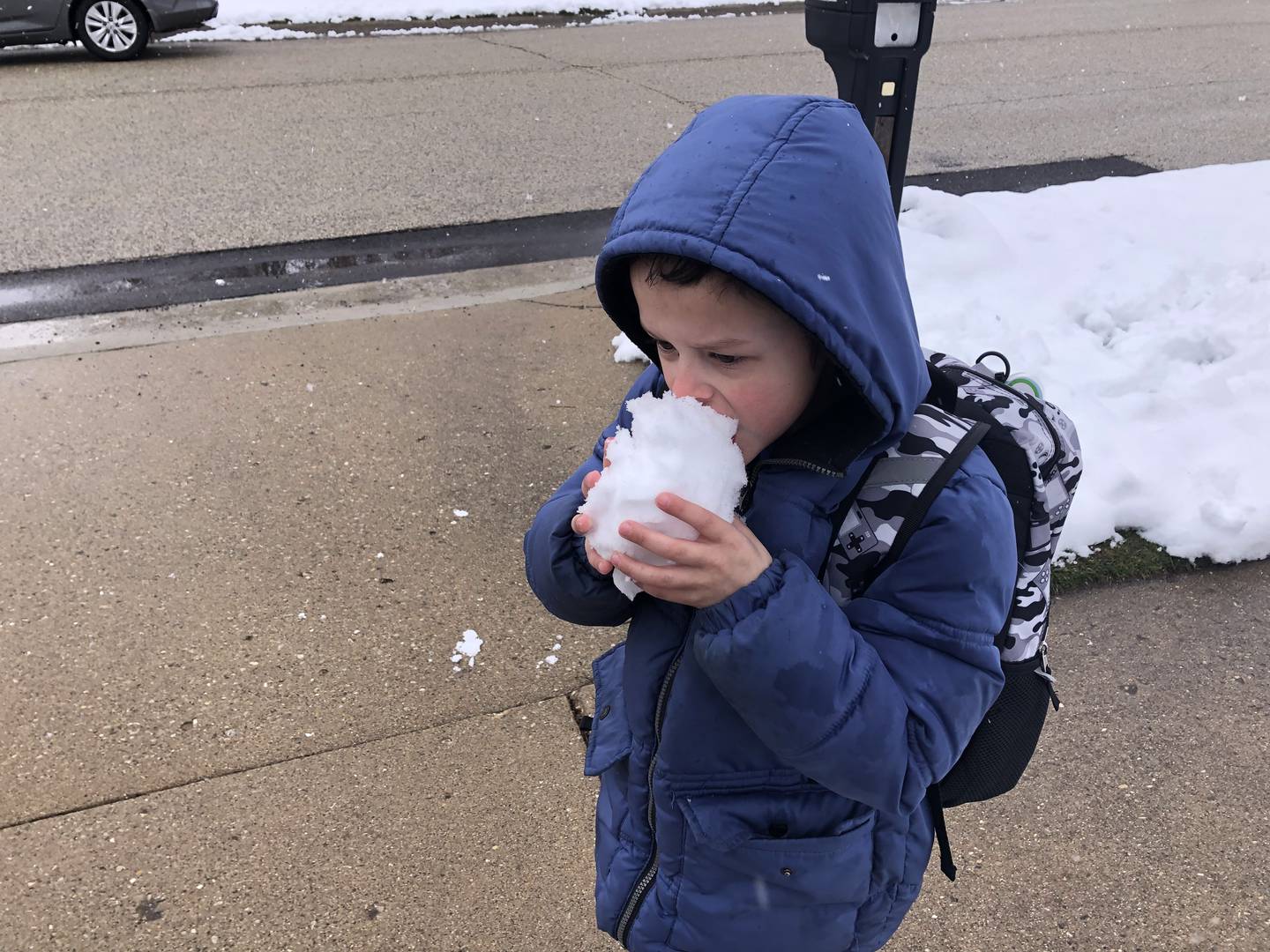 Aiden Jaglowski, 6, of McHenry tastes snow March 22, 2024.