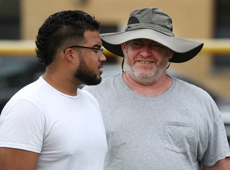 Hiawatha football coach Kenny McPeek talks to one of his assistants Tuesday, Aug. 19, 2025, during practice at the school in Kirkland.
