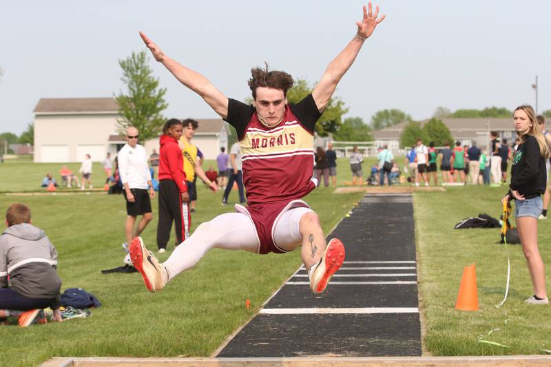 Morris's Broc Grogan competes in the long jump during the Class 2A track sectional meet on Wednesday, May 17, 2023 at Geneseo High School.