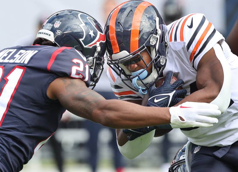Chicago Bears running back Khalil Herbert collides with Houston Texans cornerback Steven Nelson on a carry during their game Sunday, Sept. 25, 2022, at Soldier Field in Chicago.