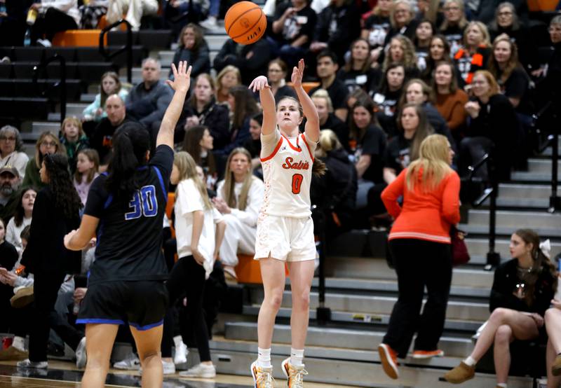 St. Charles East's Kathlyn Bainbridge shoots three points during a game against St. Charles North on Friday, Jan. 31, 2025 at St. Charles East.