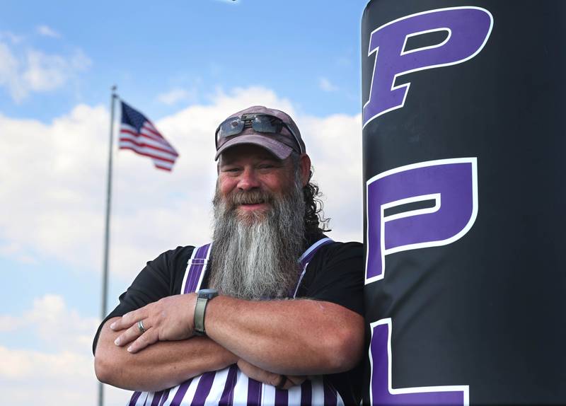 Ken Ridgeway, Plano High School grounds keeper and U.S. Navy veteran, on the football field he takes care of at the school.