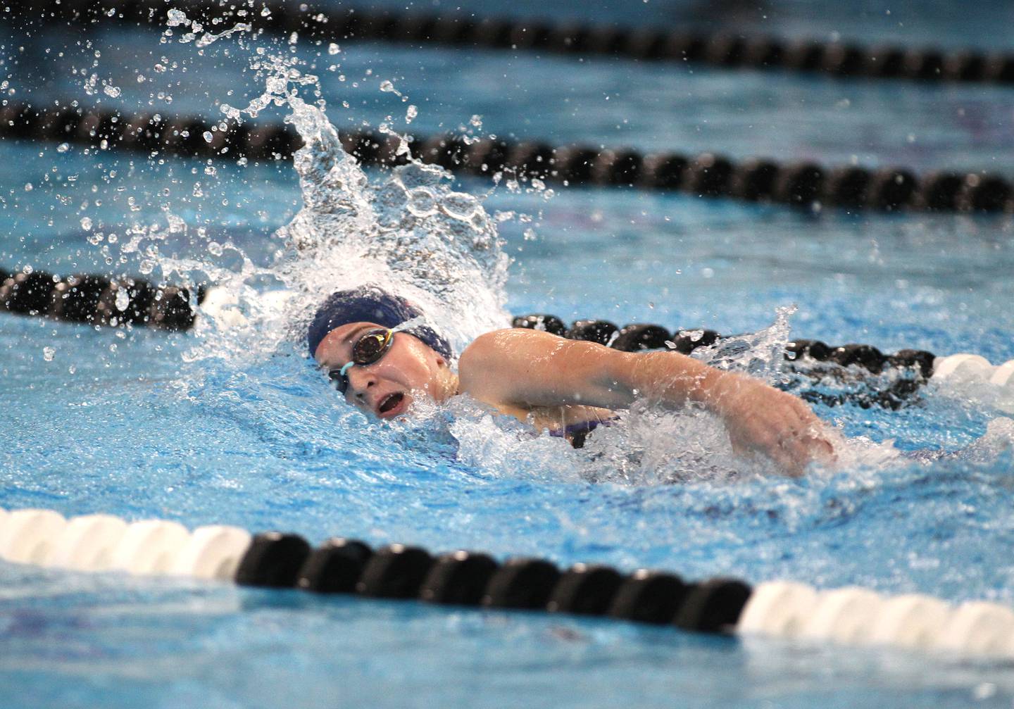 Oswego co-op's Hailey Fris swims in the consolation heat o the 400-yard freestyle relay during the IHSA Girls State Swimming and Diving Championships at FMC Natatorium in Westmont on Saturday, Nov. 13, 2021.