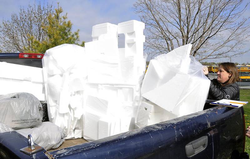 Jennifer Hawker, a volunteer from the Oswego Presbyterian Church, packages up styrofoam for recycling.