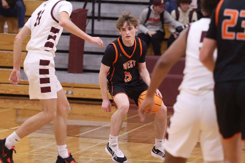 Lincoln-Way West’s Luke Schoppe works the ball against Lockport on Friday, Dec. 6, 2024 in Lockport.