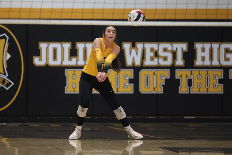 Joliet West’s Olivia Baxter receives the serve against Lincoln-Way West on Tuesday, Sept. 12, in Joliet.